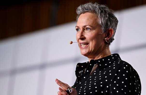 Inga Beale speaking on stage.