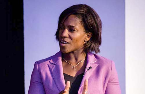 Maggie Alphonsi speaking on stage.