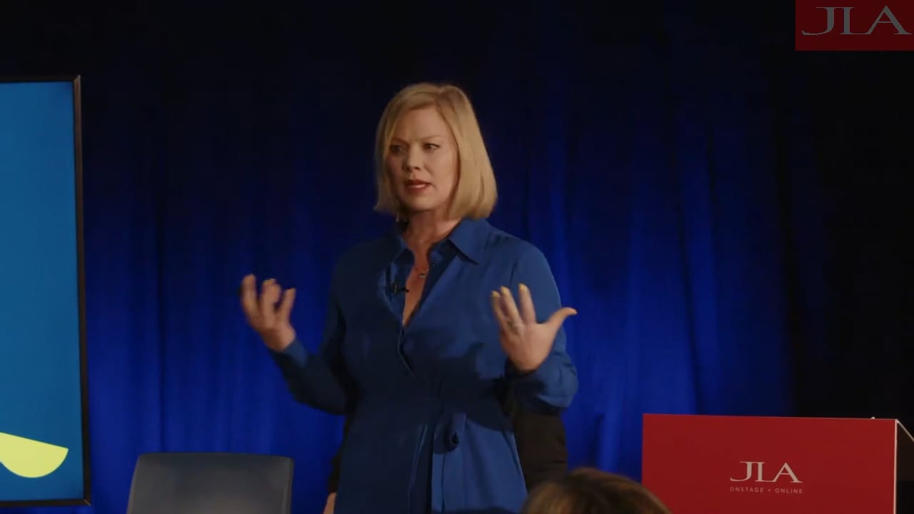 Petra Velzeboer speaking on stage