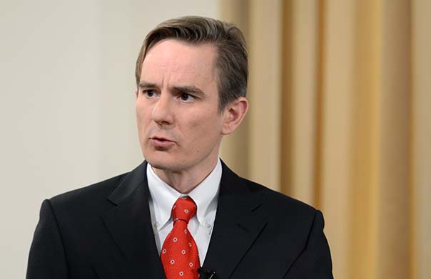Robert Guest speaking at an event.