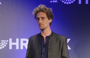 Ronan Harrington speaking on stage.