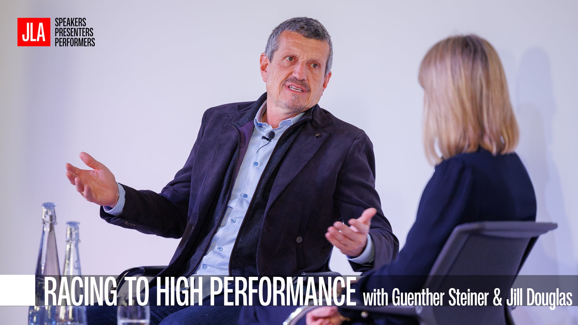 Guenther Steiner speaking on stage at JLAs Speakers Breakfast