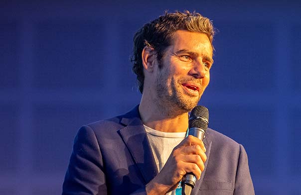 Marc Priestley speaking on stage
