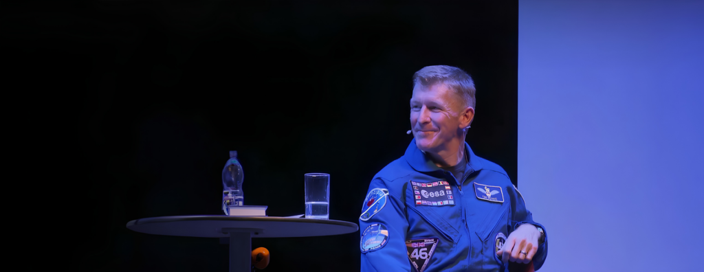 Tim Peake speaking on stage.
