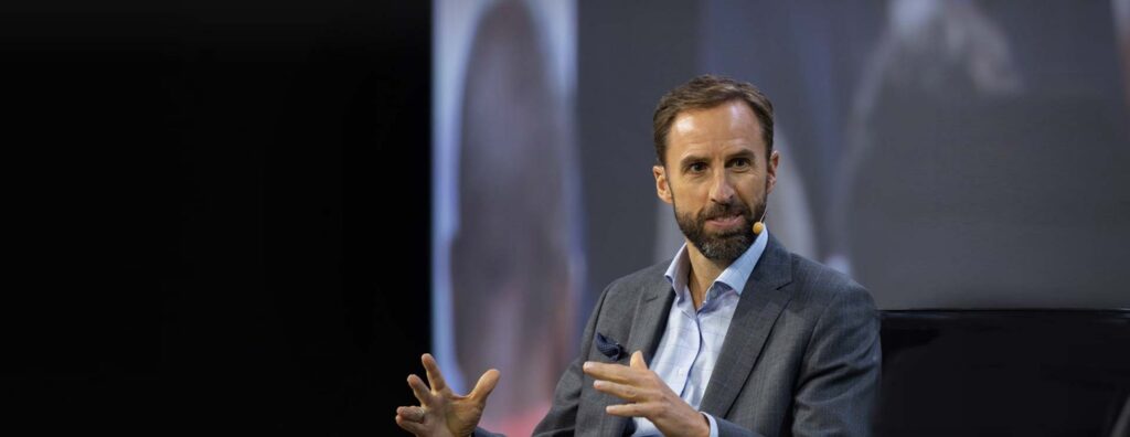 Gareth Southgate speaking on a stage.