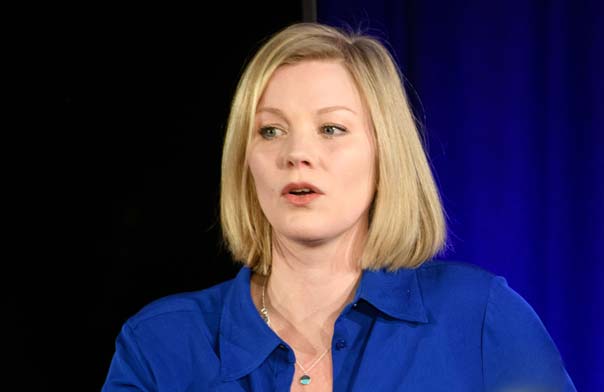 Petra Velzeboer speaking on stage at JLA event