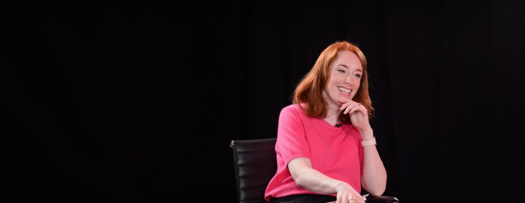 Hannah Fry speaking on a stage.