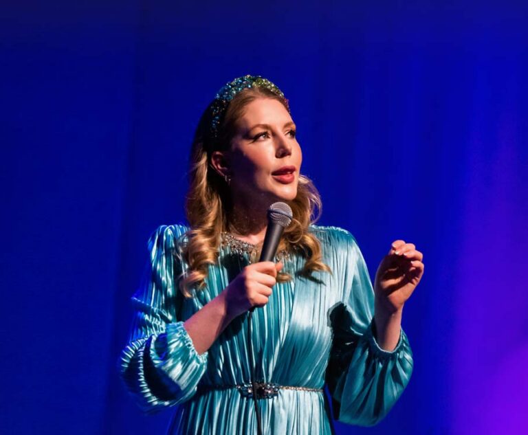 Katherine Ryan speaking on a stage.