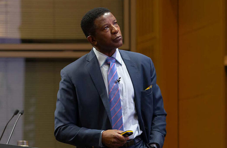 Trevor WIlliams, economic speaker on stage